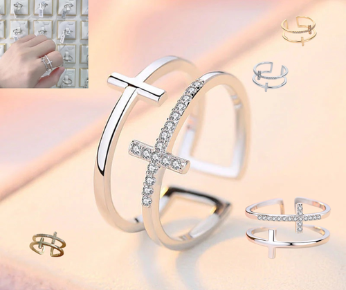 Silver bracelet with cross design on a light pink background